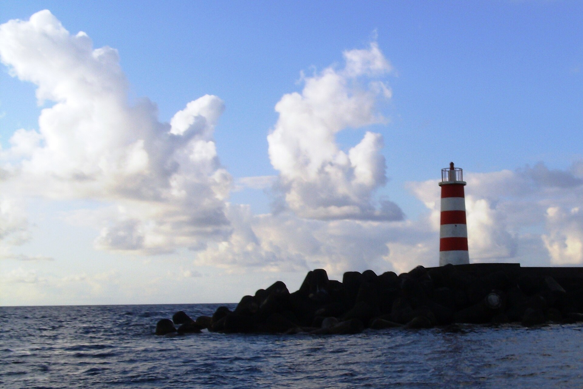 The lighthouse at the entrance to Madalena harbour, where the Faial ferry berths