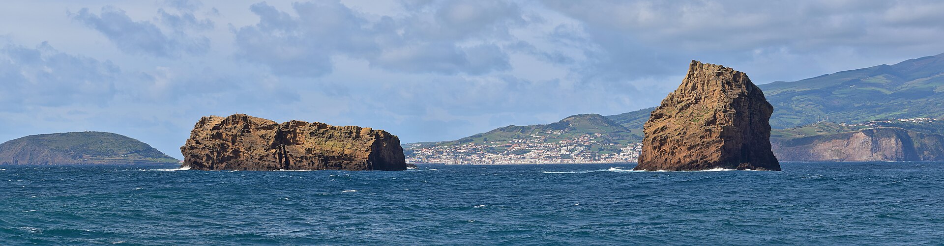 The two rock islets standing offshore from Madalena, seen from the water